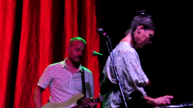 Laetitia Sadier fiddling with her moog and Xavi Muñoz doo-doodling his bass.